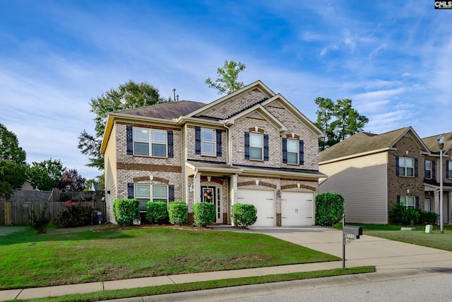 view of front of property featuring a garage and a front lawn