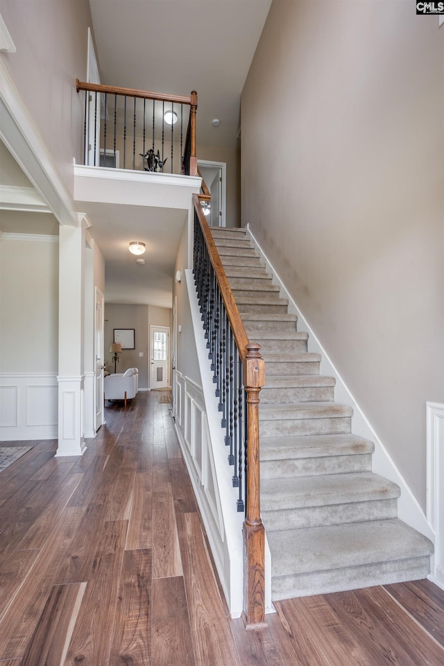 stairway with hardwood / wood-style flooring