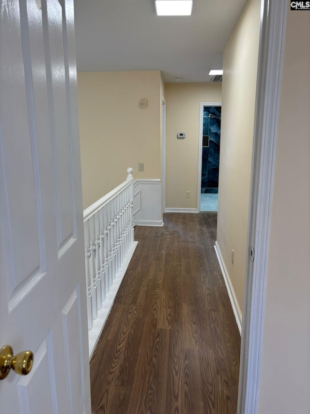 hall with dark wood-type flooring