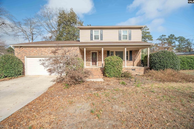 front facade featuring a porch and a garage