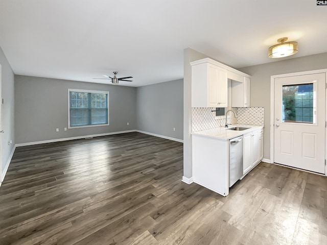 kitchen featuring sink, white cabinets, a healthy amount of sunlight, and stainless steel dishwasher