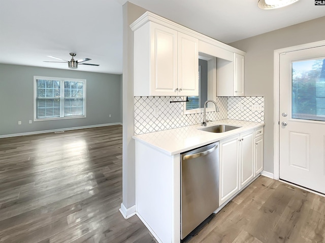 kitchen featuring ceiling fan, sink, stainless steel dishwasher, wood-type flooring, and white cabinets