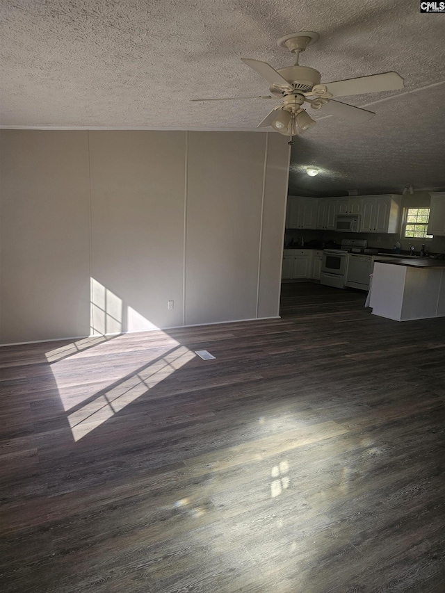 1611 Carolina Ln, Beaufort, SC 29906 - spare room featuring a textured ceiling, dark hardwood / wood-style floors, and ceiling fan