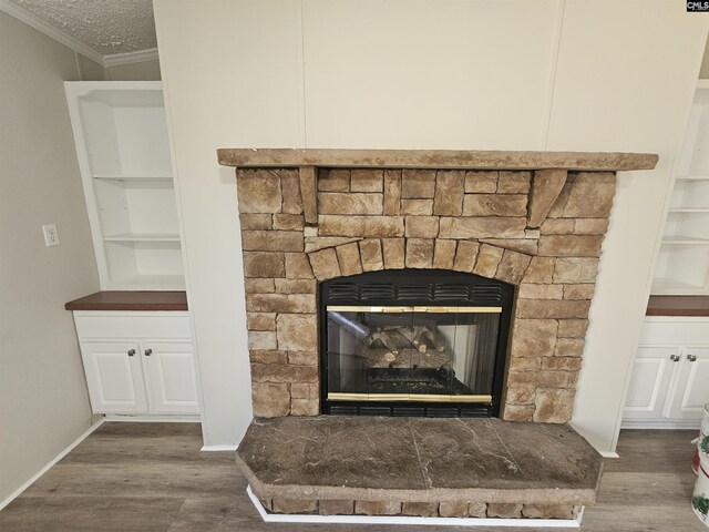 1611 Carolina Ln, Beaufort, SC 29906 - interior details with crown molding, a fireplace, built in features, and hardwood / wood-style flooring