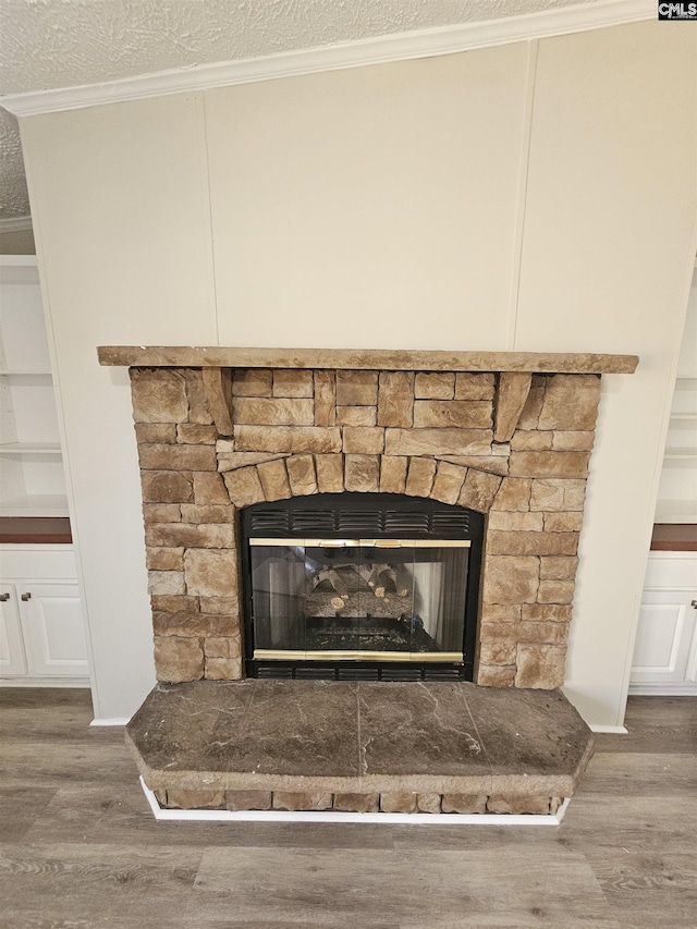 1611 Carolina Ln, Beaufort, SC 29906 - interior details featuring a textured ceiling, crown molding, a fireplace, and hardwood / wood-style flooring