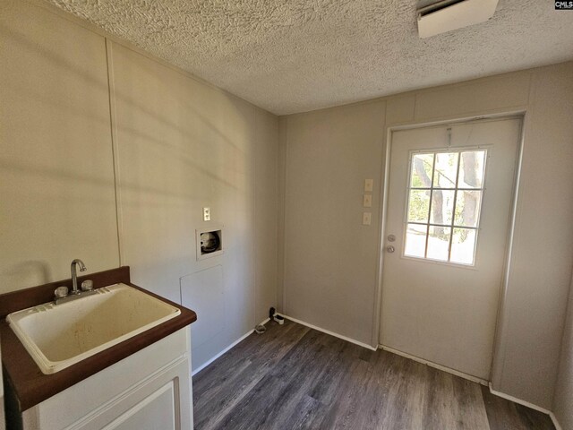1611 Carolina Ln, Beaufort, SC 29906 - clothes washing area featuring a textured ceiling, sink, hookup for a washing machine, and dark wood-type flooring