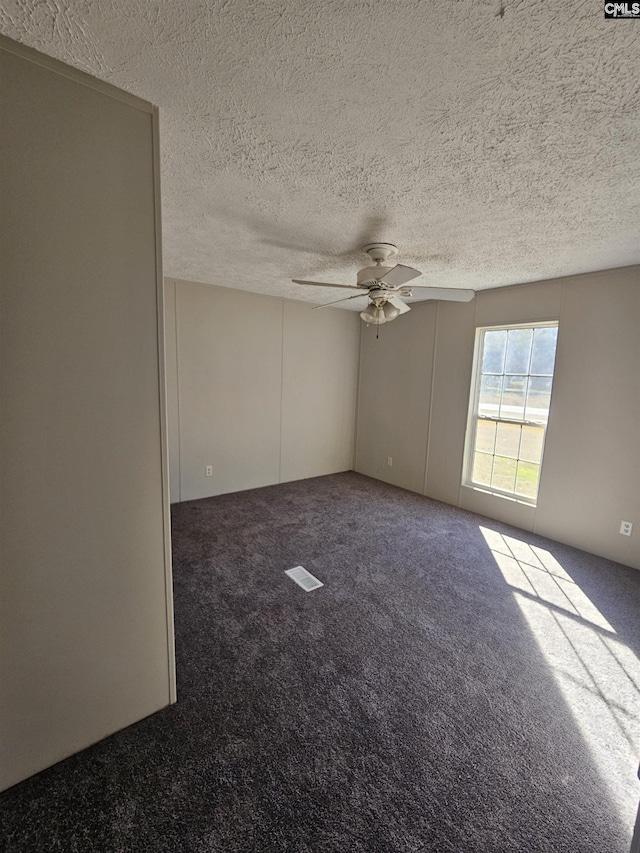 1611 Carolina Ln, Beaufort, SC 29906 - carpeted empty room with ceiling fan and a textured ceiling