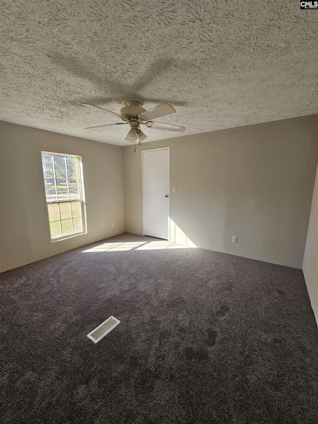 1611 Carolina Ln, Beaufort, SC 29906 - empty room with ceiling fan, carpet floors, and a textured ceiling