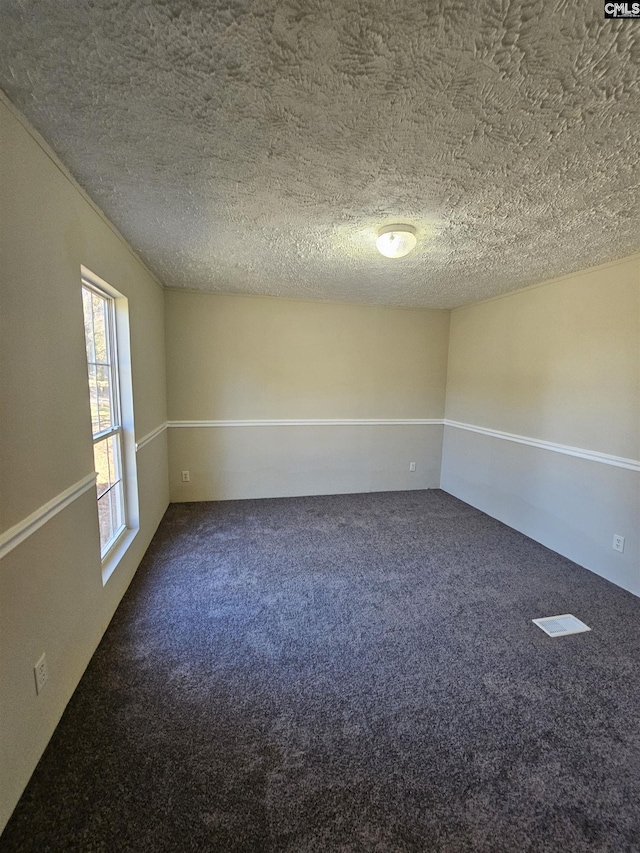 1611 Carolina Ln, Beaufort, SC 29906 - unfurnished room with a textured ceiling and carpet floors