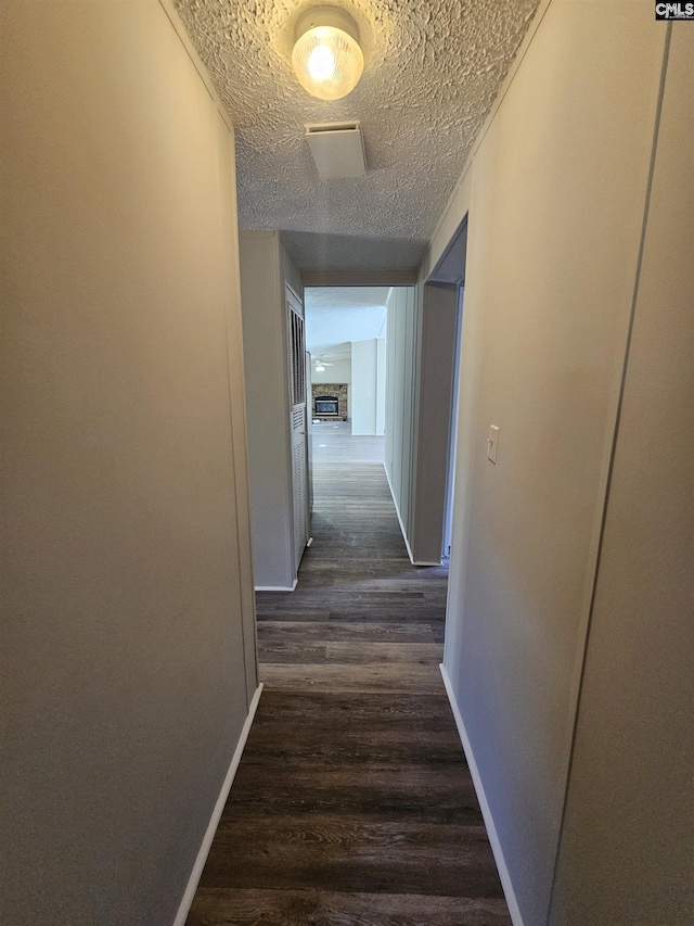 1611 Carolina Ln, Beaufort, SC 29906 - corridor with a textured ceiling and dark hardwood / wood-style floors