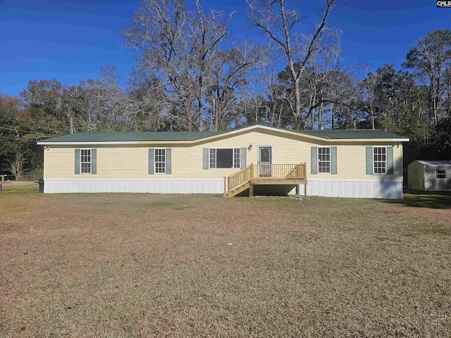 1611 Carolina Ln, Beaufort, SC 29906 - manufactured / mobile home with a front yard and a storage unit