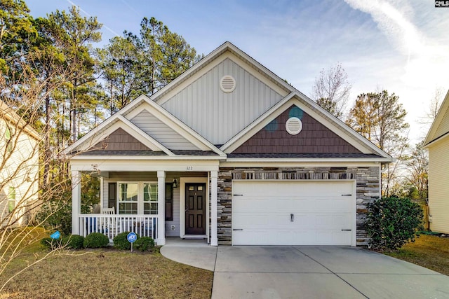 craftsman-style house featuring a garage and covered porch