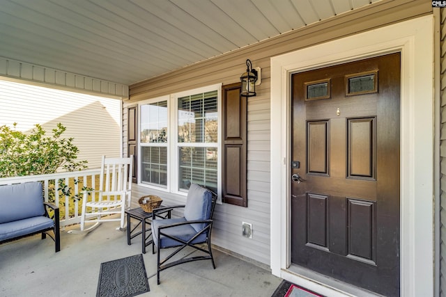 property entrance with covered porch