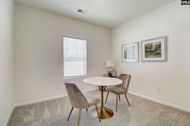 view of carpeted dining space