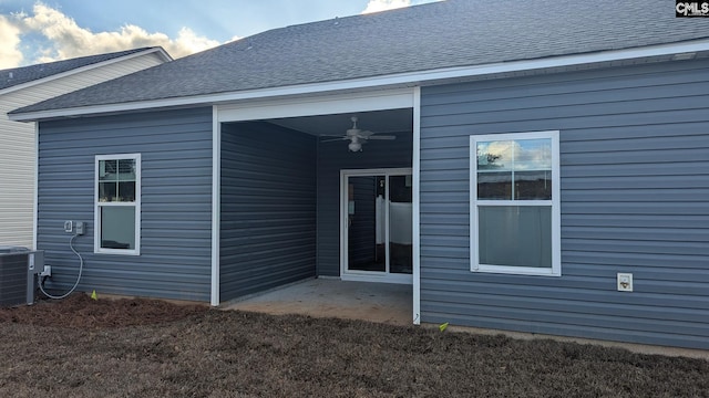 back of house with ceiling fan, cooling unit, and a patio