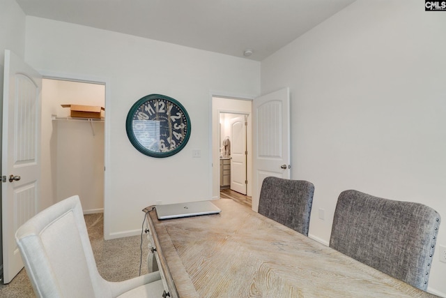 dining area with light colored carpet