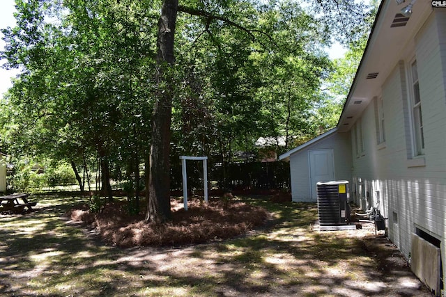 view of yard featuring central air condition unit