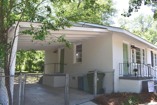 view of side of home featuring a carport