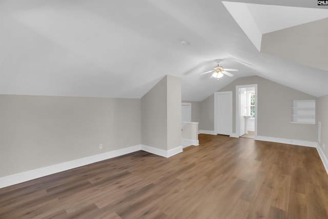 bonus room featuring hardwood / wood-style flooring, ceiling fan, and lofted ceiling