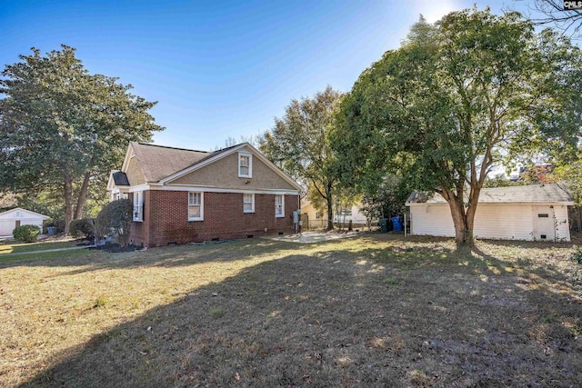 view of side of property with a yard