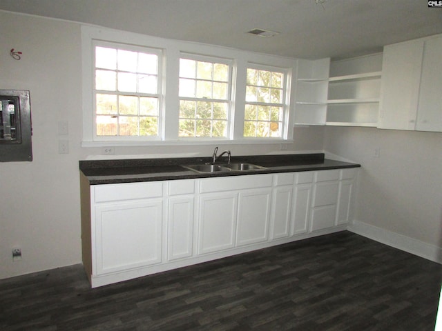 kitchen with white cabinets, a healthy amount of sunlight, and sink