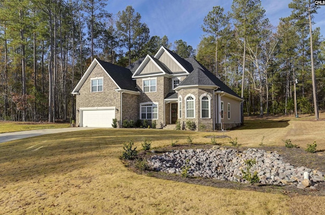 view of front of house featuring a garage and a front lawn