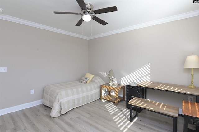 bedroom with light wood-type flooring, ceiling fan, and crown molding