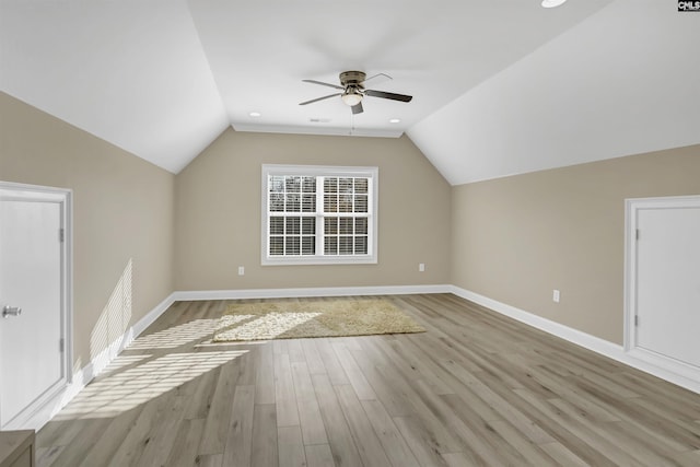 additional living space with light hardwood / wood-style floors, ceiling fan, and lofted ceiling