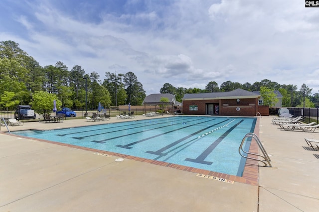 view of swimming pool with a patio