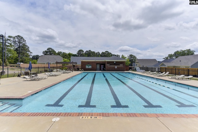 view of swimming pool with a patio