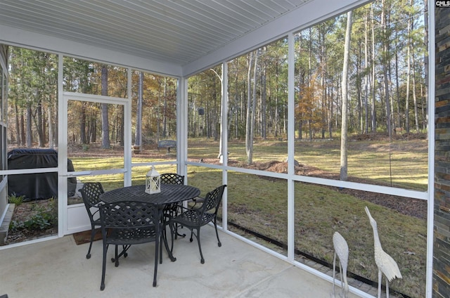 sunroom / solarium featuring plenty of natural light