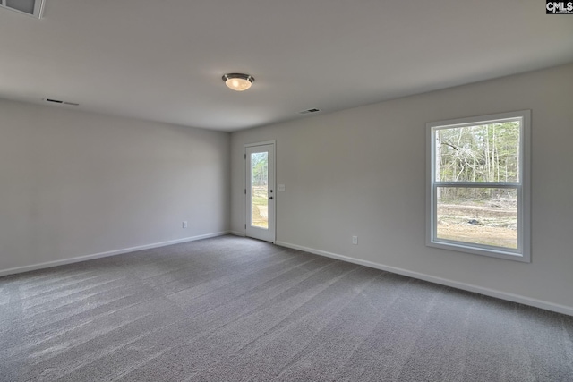 spare room featuring carpet