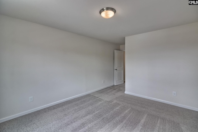 unfurnished room with light colored carpet