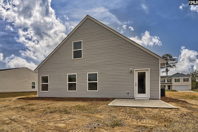 rear view of property featuring a patio area