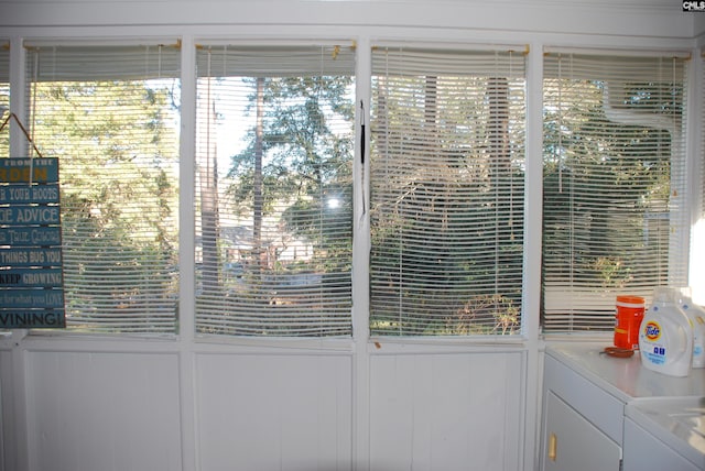 doorway to outside featuring washer and clothes dryer