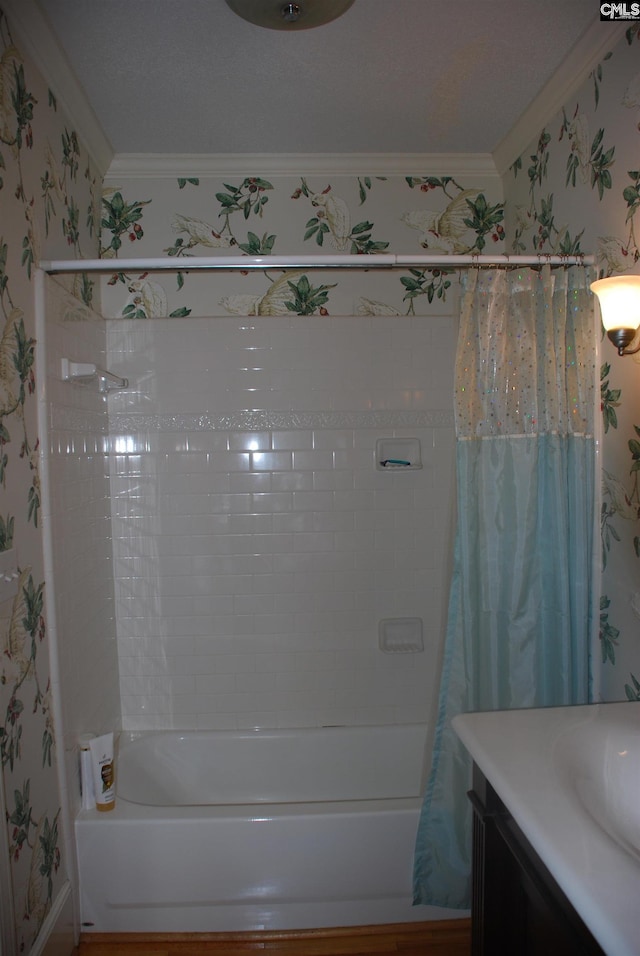 bathroom featuring crown molding, vanity, and shower / bath combination with curtain