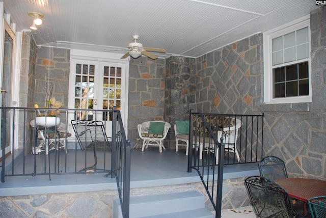 view of patio featuring ceiling fan and french doors