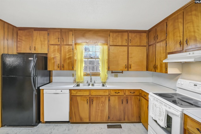 kitchen featuring white appliances and sink