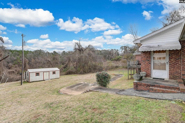 view of yard with a shed and a deck