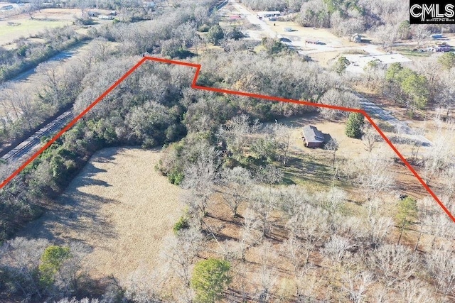birds eye view of property with a rural view