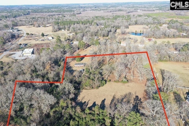 bird's eye view featuring a forest view