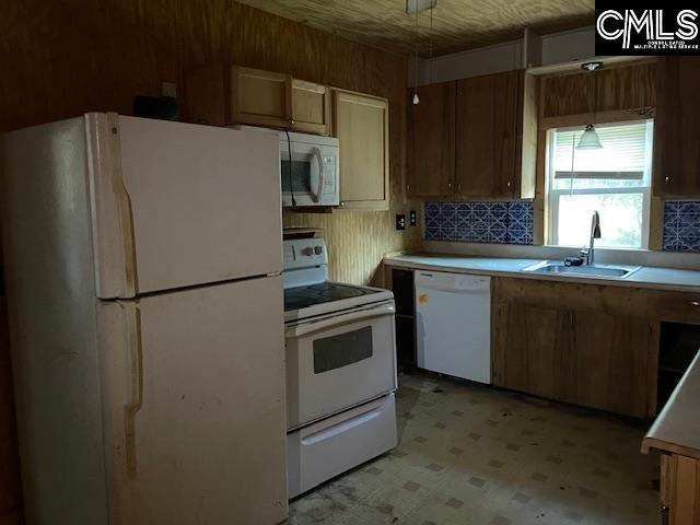 kitchen with white appliances and sink