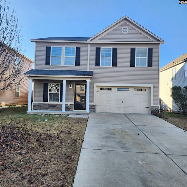 view of property with a garage and a front lawn