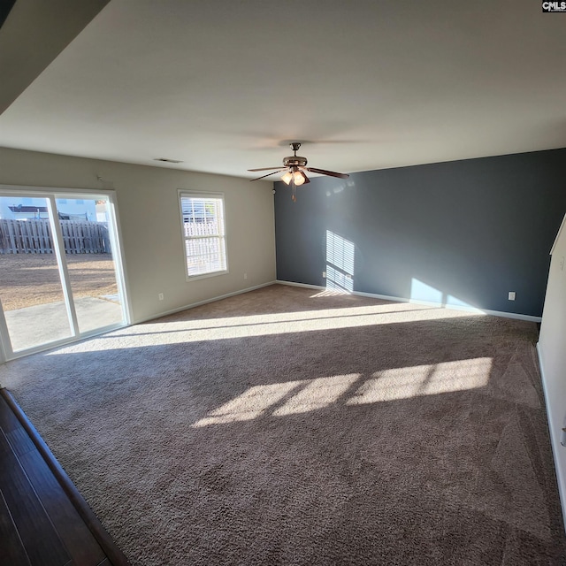 empty room with carpet flooring and ceiling fan