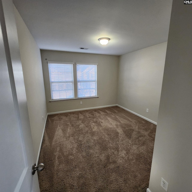 unfurnished room with carpet flooring