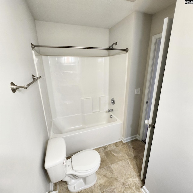 bathroom featuring toilet and tub / shower combination