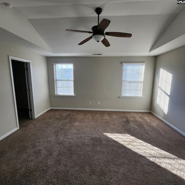 carpeted empty room featuring ceiling fan and vaulted ceiling