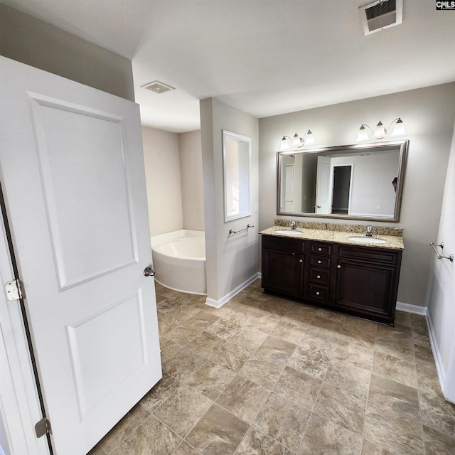 bathroom with vanity and a tub to relax in