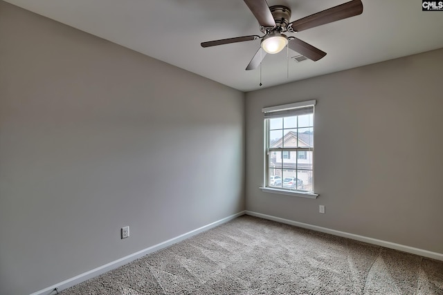 carpeted empty room featuring ceiling fan