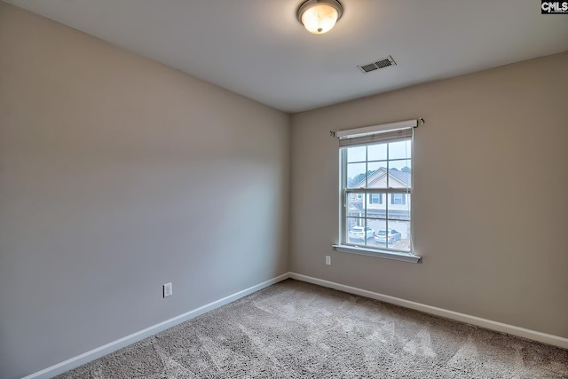 empty room featuring carpet floors